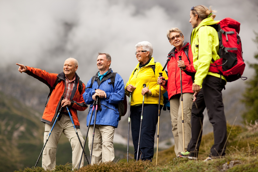 senior hiker pointing at something